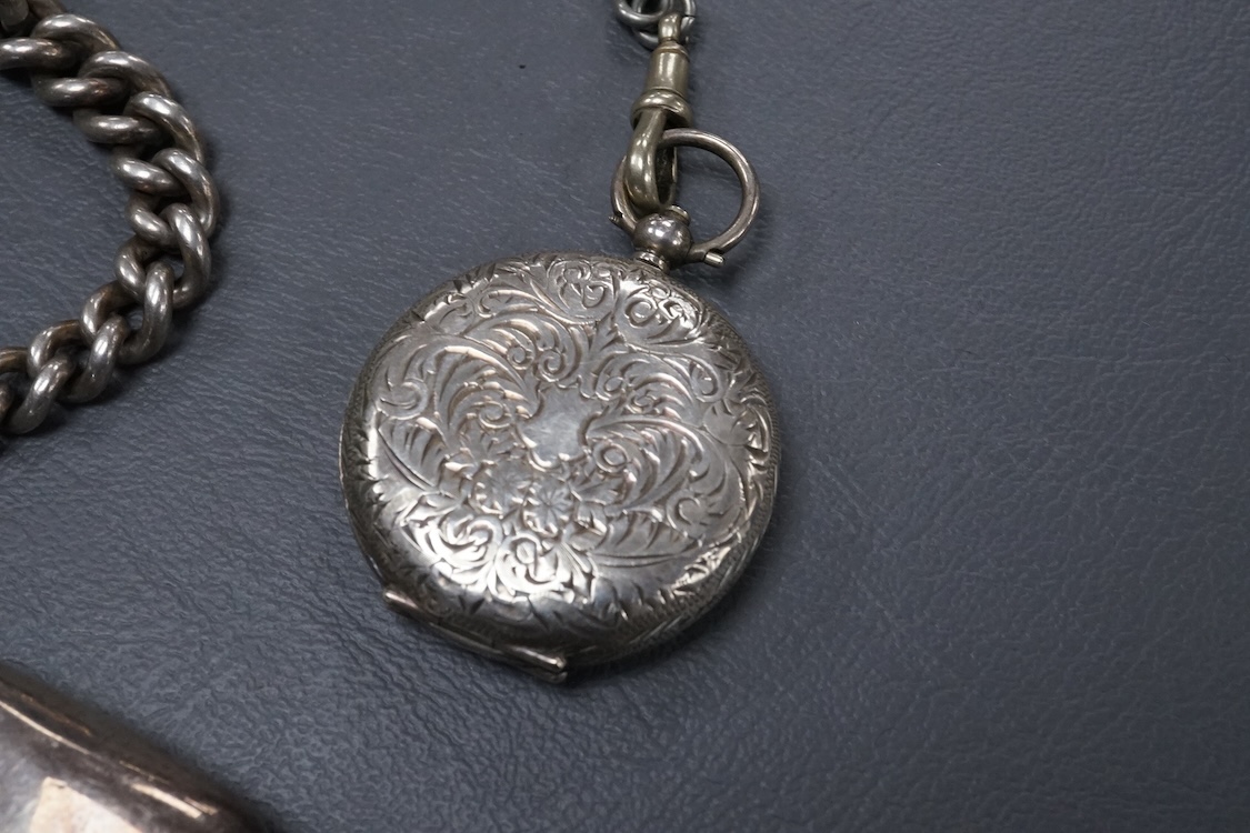A late Victorian silver open faced key wind pocket watch, with Roman dial and subsidiary seconds, case diameter 52mm, on a heavy silver curb link albert, hung with a silver vesta case and a watch key, together with a con